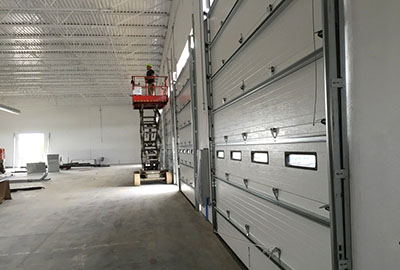 image of garage door that has gone through emaergency garage door repair